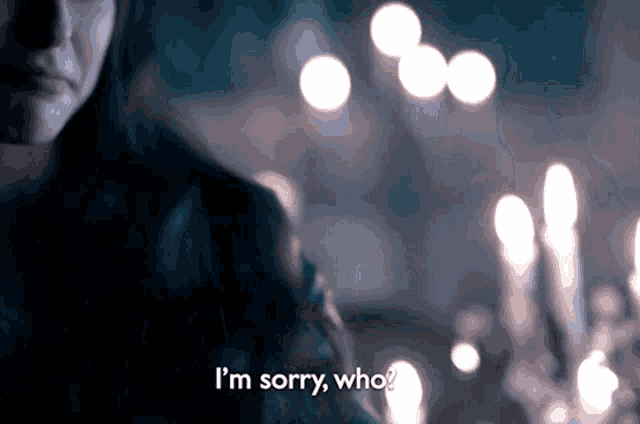 a woman says i 'm sorry who in front of a bunch of candles
