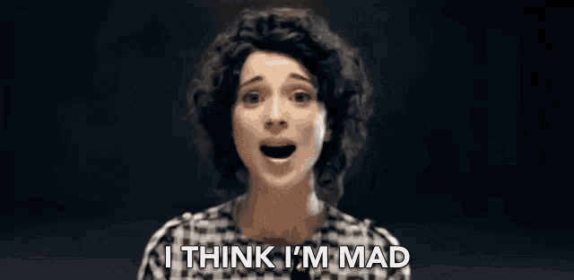 a woman with curly hair is making a funny face and says `` i think i 'm mad '' .