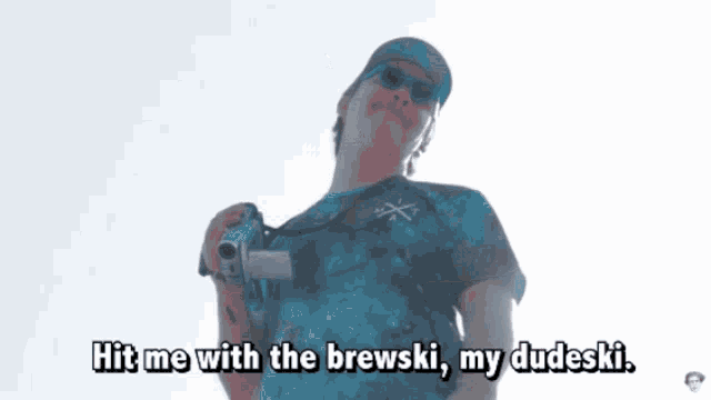 a man is standing on the roof of a house holding a skateboard