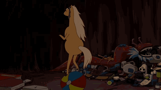 a horse is standing on a ball in a dark room