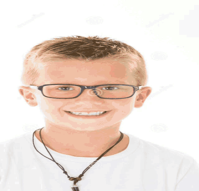 a young boy wearing glasses and a black necklace smiles for the camera
