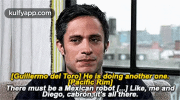 a man is sitting in front of a window with a caption that says there must be a mexican robot