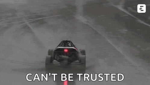 a buggy is driving on a wet track with the words `` can 't be trusted '' written on the bottom .