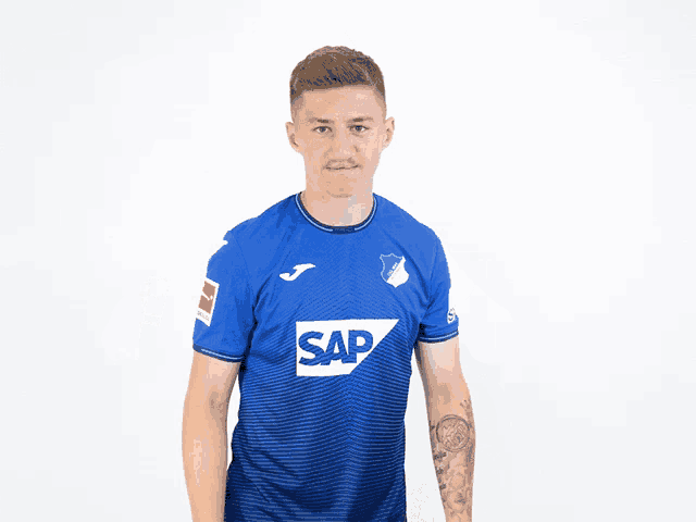 a man is wearing a blue shirt with the word sap on it