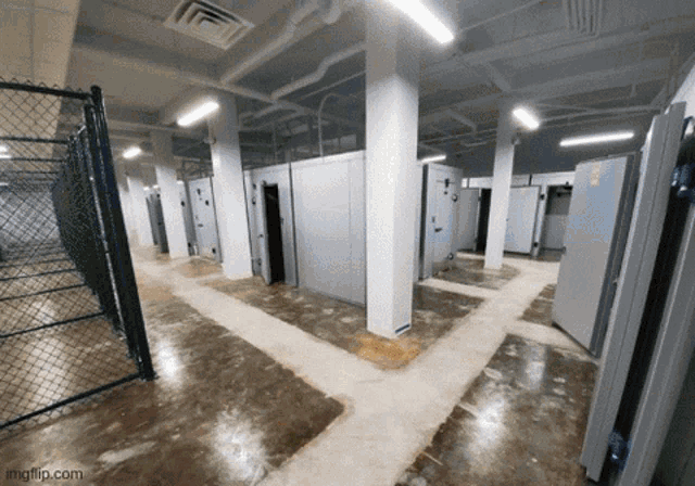 a room with a chain link fence and a watermark that says imgflip.com on the bottom