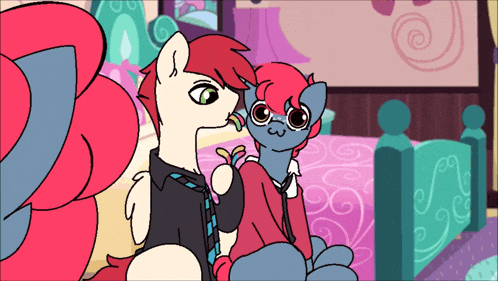 a couple of ponies are sitting next to each other