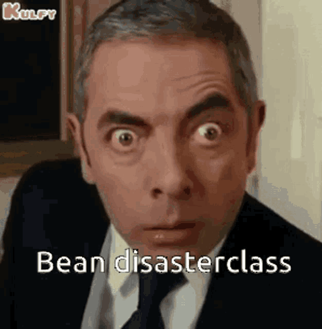 mr bean is making a funny face and saying bean disasterclass .