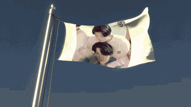 a flag with a picture of two boys on it