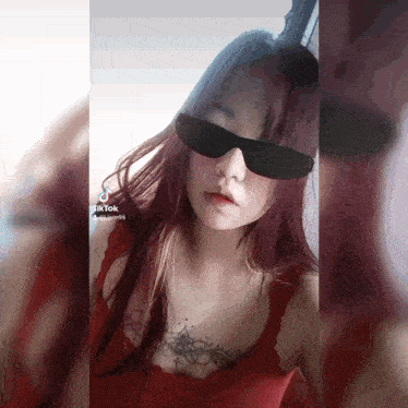 a woman with red hair wearing sunglasses and a tattoo on her chest has a tiktok account