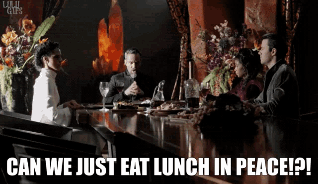 a group of people sitting at a table with a caption that says can we just eat lunch in peace