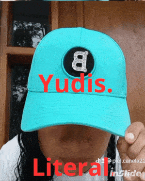 a person wearing a blue hat that says yudis