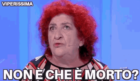a woman with red hair says non e che e morto ?