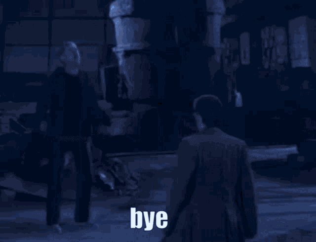 a person standing in a dark room with the word bye written in white letters