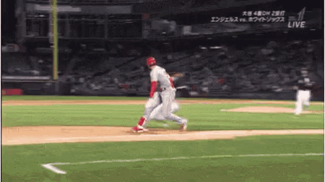 a baseball player is running towards home plate during a game .