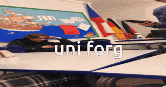 a classroom with the word uni forg written on the wall
