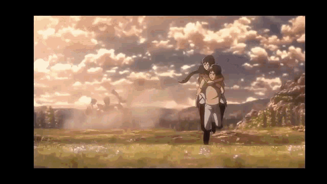a man is carrying a woman on his shoulders in a field