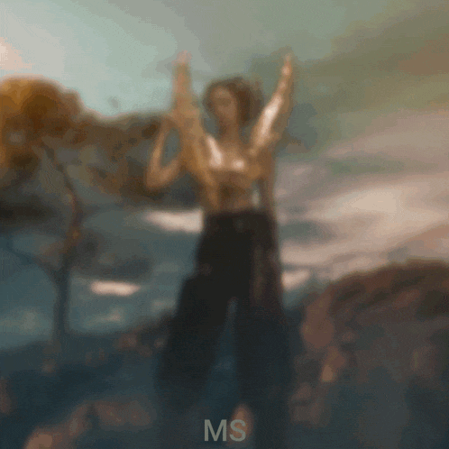 a blurry picture of a person with the letters ms on the bottom right