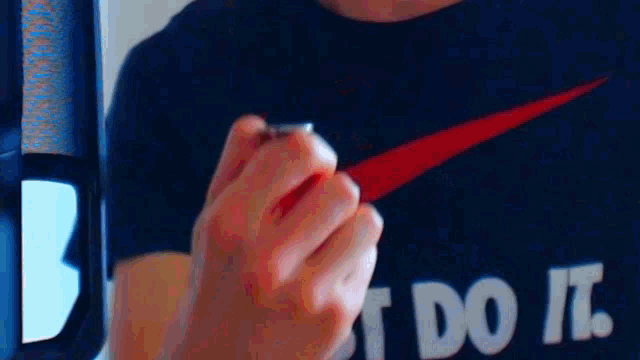 a man wearing a shirt that says just do it