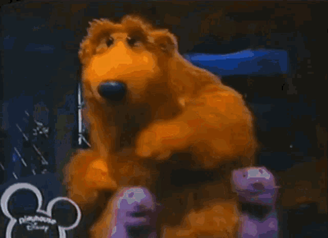a picture of a teddy bear with a disney logo