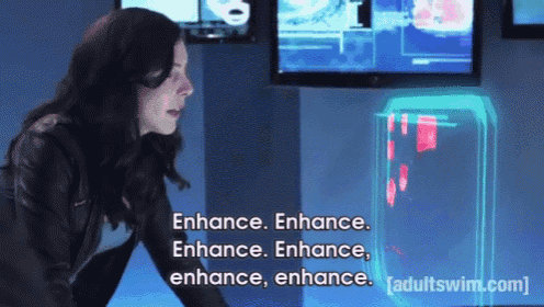 a woman is standing in front of a screen that says enhance enhance enhance enhance enhance enhance