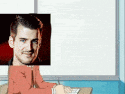 a man is sitting at a desk in front of a white board