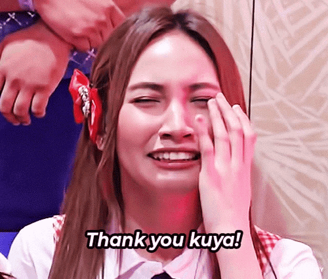 a woman crying with the words thank you kuya written on the bottom