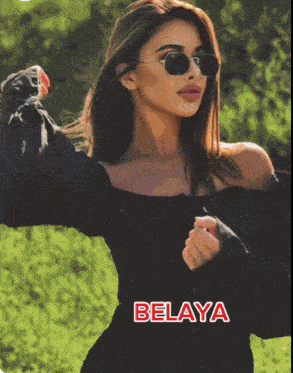 a woman wearing sunglasses and a black dress has the name belaya on the bottom right