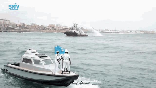 a boat with a sntv logo on the bottom of it