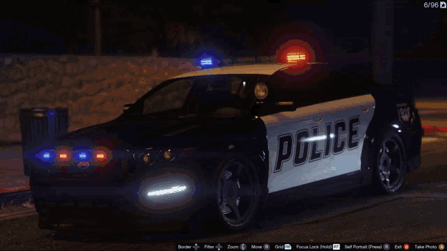 a police car is parked on a street at night