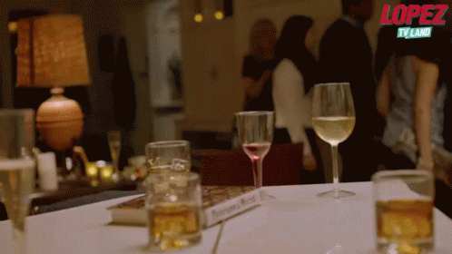 Hiding Drink GIF - George Lopez Drink Steal GIFs