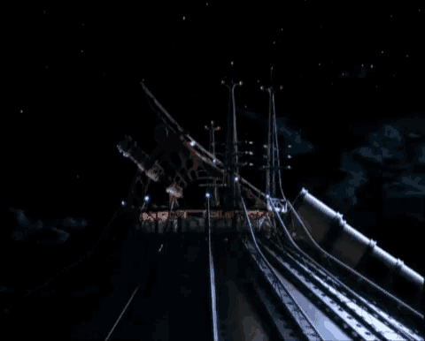 a large telescope is lit up in the dark with a few lights on it