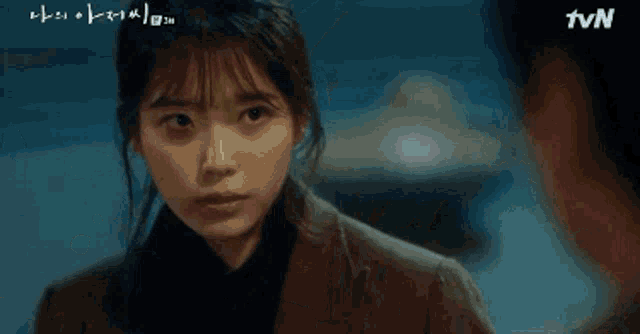a close up of a woman 's face with the tvn logo visible