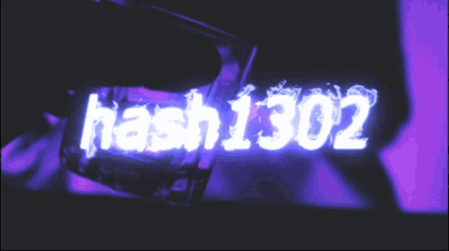 a person is holding a glass that says hash1302 on it