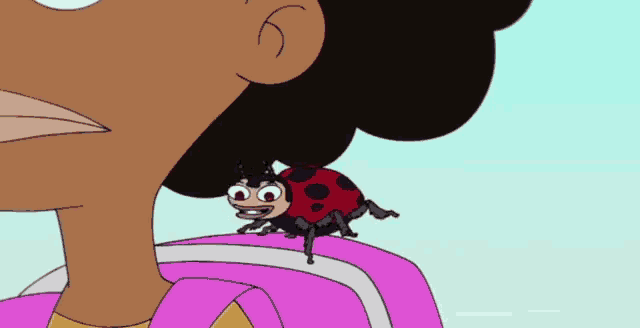 a ladybug is sitting on a girl 's backpack