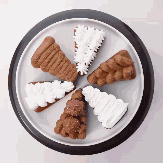 a white plate topped with a variety of desserts and whipped cream
