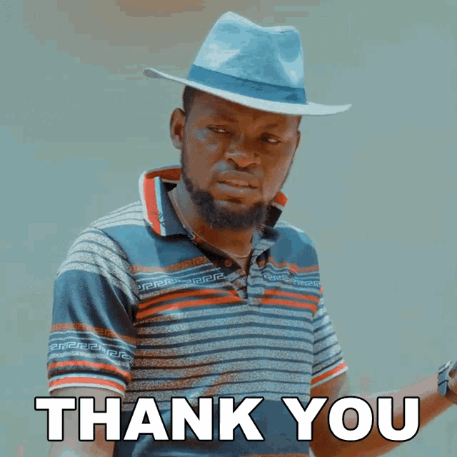 a man with a beard wearing a hat and a shirt that says thank you