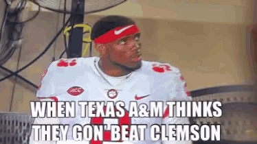 a football player wearing a headband with the words when texas a & m thinks they gon ' beat clemson