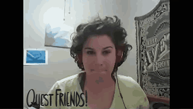 a woman wearing headphones stands in front of a sign that says " quest friends "