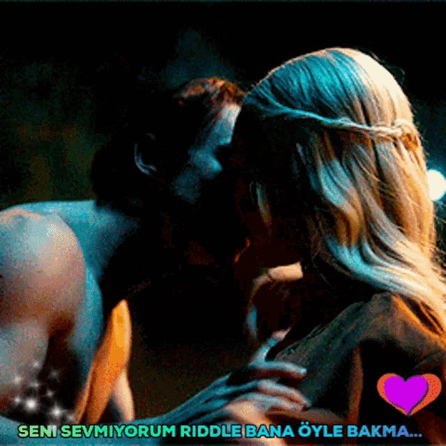 a man and a woman kissing with the words seni sevmiyorum riddle bana öyle bakma below them