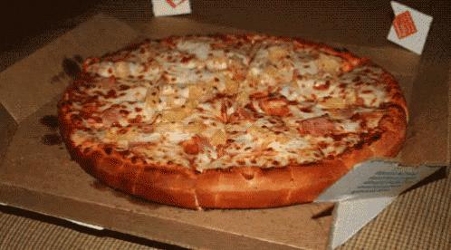 a pizza in a cardboard box with a sticker on it that says ' sauce '