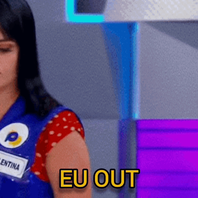 a woman in a blue vest with a name tag that says eu out