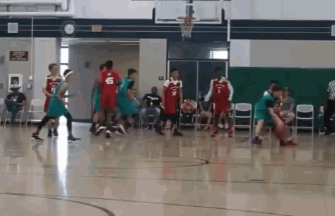 a basketball game is being played in a gym with a player wearing the number 45