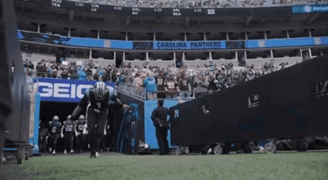 the carolina panthers are playing a game in a stadium sponsored by geico