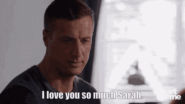 a man says " i love you so much sarah " in front of a window