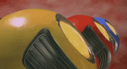 a yellow red and blue ball with a black rim