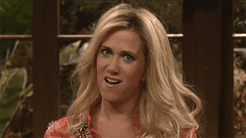 a man with blonde hair is making a funny face in front of a nbc logo