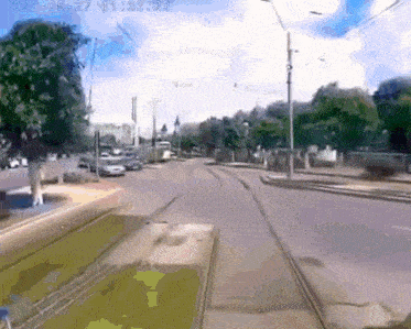 a trolley is going down a street with a time of 1:33:22 on the bottom