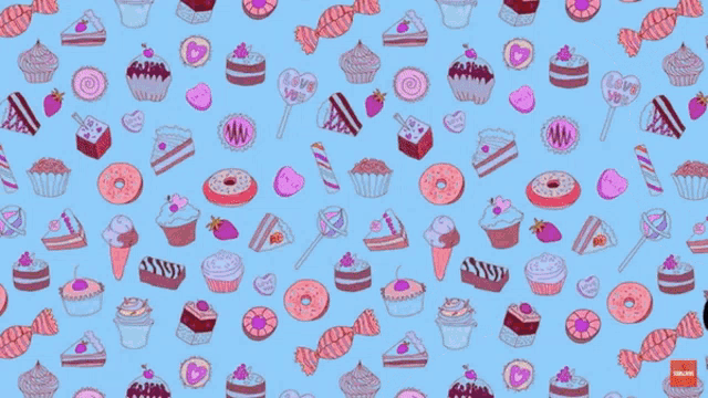 a man with a beard is smiling in front of a pattern of cupcakes