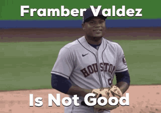 a baseball player wearing a houston astros jersey is standing on a baseball field .
