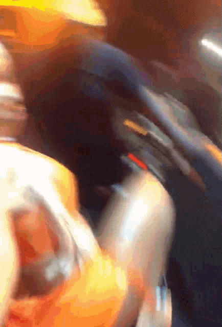 a blurry picture of a person 's face and a blurred background